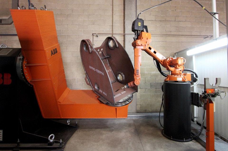 ABB welding robot in a fabrication workshop